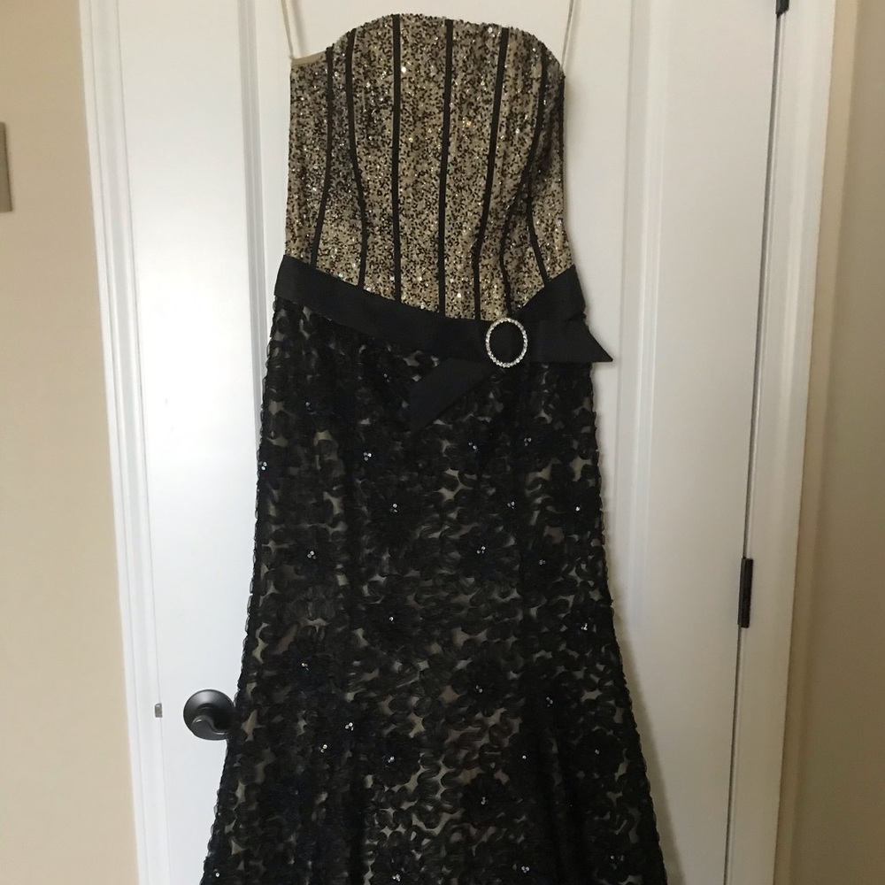 Sequenced and embroidered strapless evening gown.